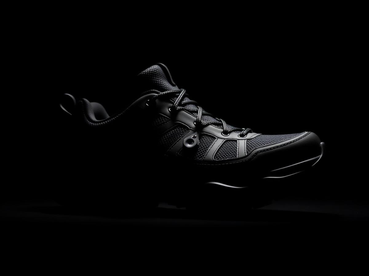 Technical trekking shoe with a charging port detail